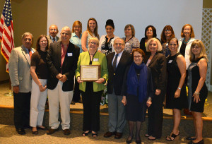 Mary Uzzi receives Dr Celia Weisman Award; family and coalition members attended ceremony.